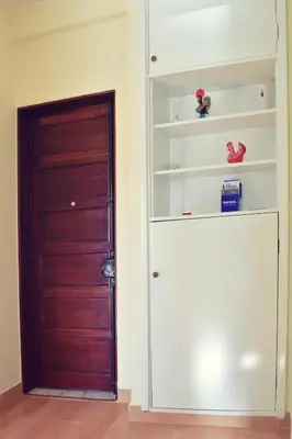 a room with a door and a shelf at A Casa da Maria in Porto