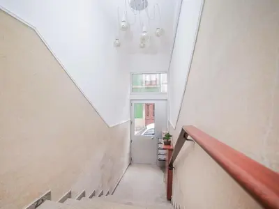 an attic hallway with a white ceiling and stairs at CM Vintage Apartments in Porto