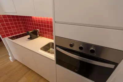 a kitchen with a sink and a sink at charm in C - Porto Center Apartment in Porto