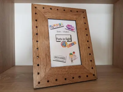 a wooden frame with stickers on it on a table at Porto In Sight, 4 Kids in Vila Nova de Gaia