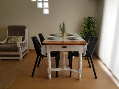 a dining room table with chairs and a plant on it at Porto In Sight, 4 Kids in Vila Nova de Gaia