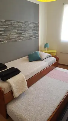 two beds sitting next to each other in a room at Porto In Sight, 4 Kids in Vila Nova de Gaia