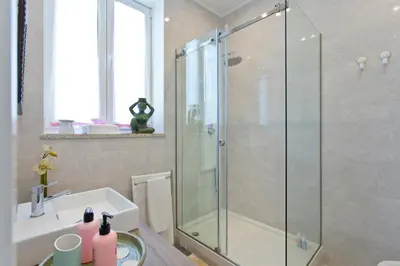 a bathroom with a shower and a sink at Luxurious Pink House and Parking in Porto