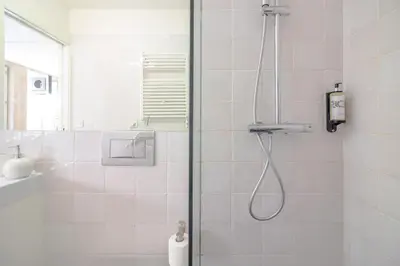 a shower with a glass door in a bathroom at YOUROPO - The Tower in Porto