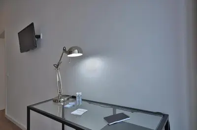 a glass table with a lamp on top of it at Casa da Ana - Porto Velho Apt in Porto