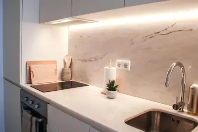 a kitchen with a sink and a counter top at Casulo Loft - Oporto Downtown in Porto