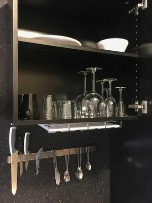 a shelf with cooking utensils on a counter at Belomonte 22 Apartments Porto World Heritage in Porto