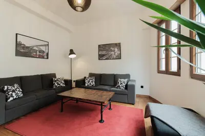 a living room with a couch and a coffee table at Puro Apartment in Porto