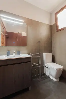 a bathroom with a toilet and a sink at Puro Apartment in Porto