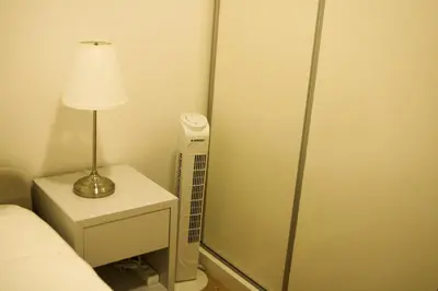 a lamp sitting on a night stand next to a bed at Nightingale Apartments in Porto