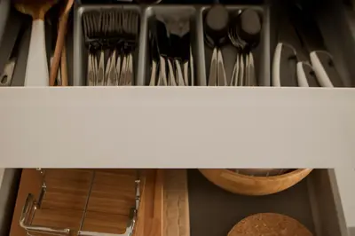 a drawer filled with utensils on a shelf at Nightingale Apartments in Porto