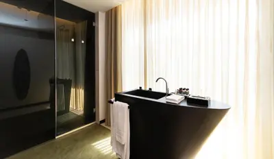 a bathroom counter with a sink and a mirror at Porto Royal Bridges Hotel in Porto