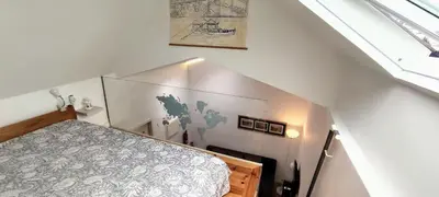 a small room with a bed in a attic at InvictaViews Loft in Vila Nova de Gaia