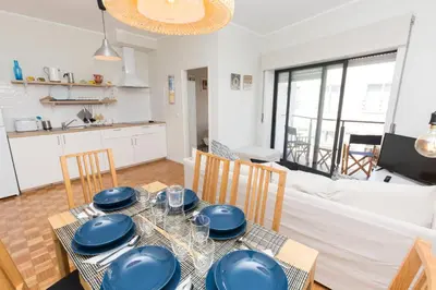 a dining room with a table with blue dishes on it at Porto Haven - Vintage Apartment in Downtown in Porto