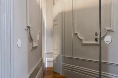 a glass shower door in a room with a hallway at Oporto Royal Apartment - Solar da Avenida in Porto