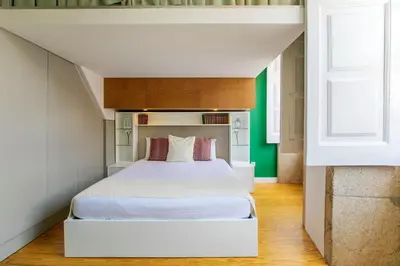 a bedroom with a white bed in a room at Casa da Cordoaria by Oporto Soul in Porto