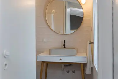 a bathroom with a sink and a mirror at Oporto Design Attic - Solar da Avenida in Porto