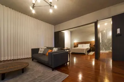 a living room with a couch and a bed at Oporto Cozy Design Studio - Solar da Avenida in Porto