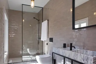 a bathroom with a shower and a toilet and a sink at Oporto Cozy Design Studio II - Solar da Avenida in Porto