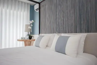 a white bed with white pillows in a bedroom at Liiiving in Porto | Downtown Luxury Studio in Porto