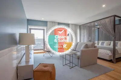 a sign for a clean and safe room in a bedroom at Liiiving in Porto | Downtown Luxury Studio in Porto