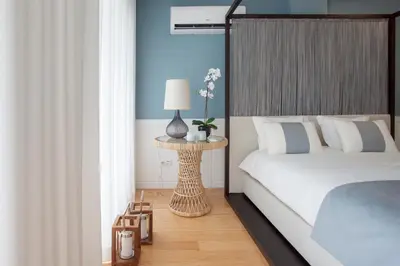 a bedroom with a bed and a table with a lamp at Liiiving in Porto | Downtown Luxury Studio in Porto