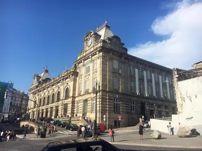 a large building with a clock tower on top of it at Casa da Catedral II in Porto