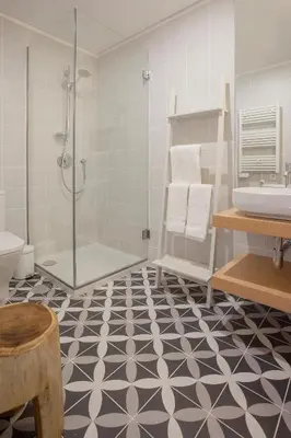 a bathroom with a shower and a toilet and a sink at Liiiving in Porto | Luxury Boutique Apartment in Porto