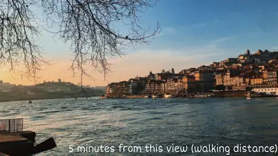a view of a river with houses and buildings at Porto Luxury Apartments in Vila Nova de Gaia