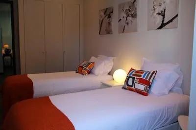 two beds in a hotel room with at 12 Short Term in Porto