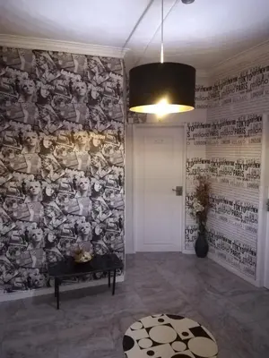 a room with a wall covered in pictures of animals at Hotel Cristo Rei in Porto