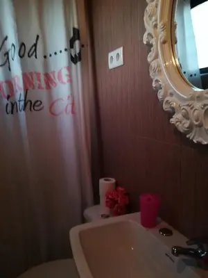 a bathroom with a sink and a mirror and a toilet at Hotel Cristo Rei in Porto