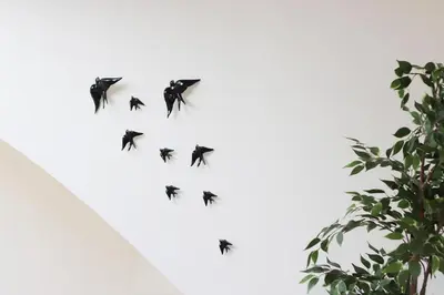 a flock of birds flying in the sky at HM - Flores Skylight in Porto
