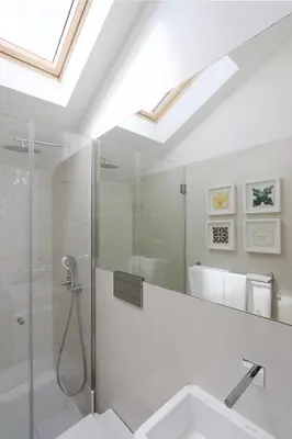 a bathroom with a shower and a sink and a mirror at HM - Flores Skylight in Porto
