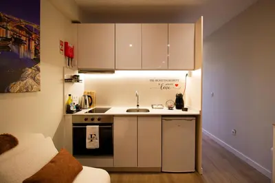 a bedroom with a large bed with blinds on it at Feel Porto in Bolhão 