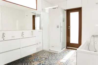 a white bathroom with a shower and a sink at BO - Álvares Cabral GuestHouse in Porto