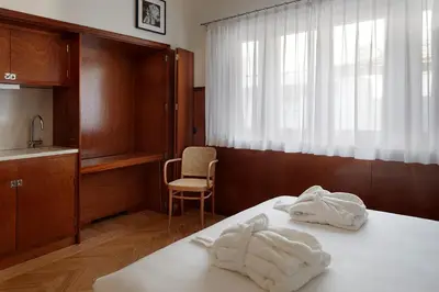 a room with a bed with white towels on it at Casa Rosa in Porto