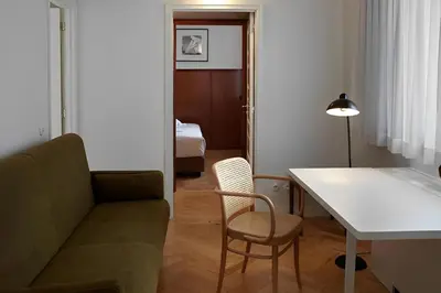 a living room with a couch and a table at Casa Rosa in Porto