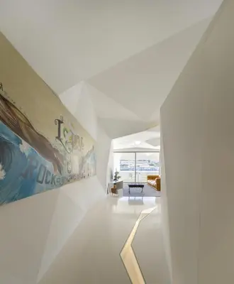 a white hallway with a painting on the wall at LeBlanche in Porto