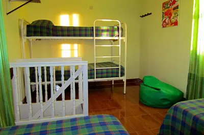 a room with two bunk beds in a room at Duas Nações Guest House in Porto