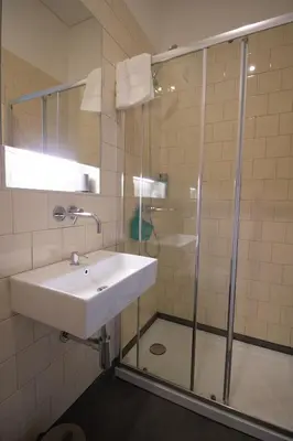 a bathroom with a sink and a shower at Step In Porto Apartments in Porto