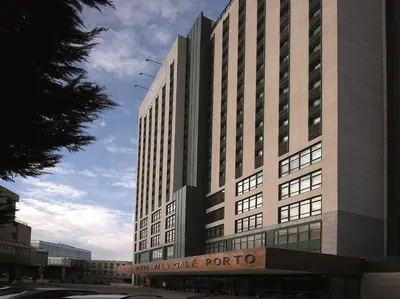 a large building with a sign in front of it at Vila Gale Porto - Centro in Porto