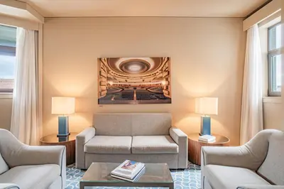 a living room with a couch and a coffee table at Hotel Dom Henrique - Downtown in Porto