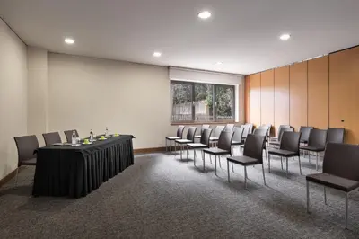 a conference room with a table and chairs at Eurostars das Artes in Porto