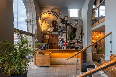a restaurant with a bar in a building at Pestana Vintage Porto Hotel & World Heritage Site in Porto