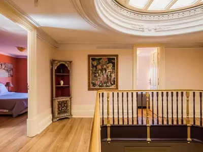 a staircase in a room with a ceiling at Pedra Iberica in Porto