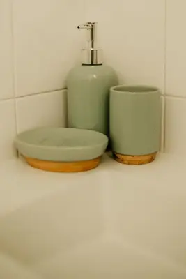 a sink and a soap dispenser on a counter at H.ö.H in Porto