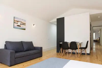 a living room with a couch and a table at Oporto Cool - Fontainhas in Porto
