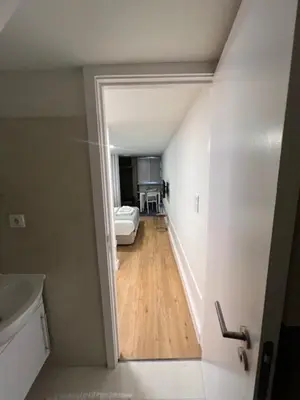a view of a hallway with a bed in a room at bnapartments Rio in Porto