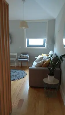 a living room with a couch and a table at S Bento Boutique Apartment in Porto